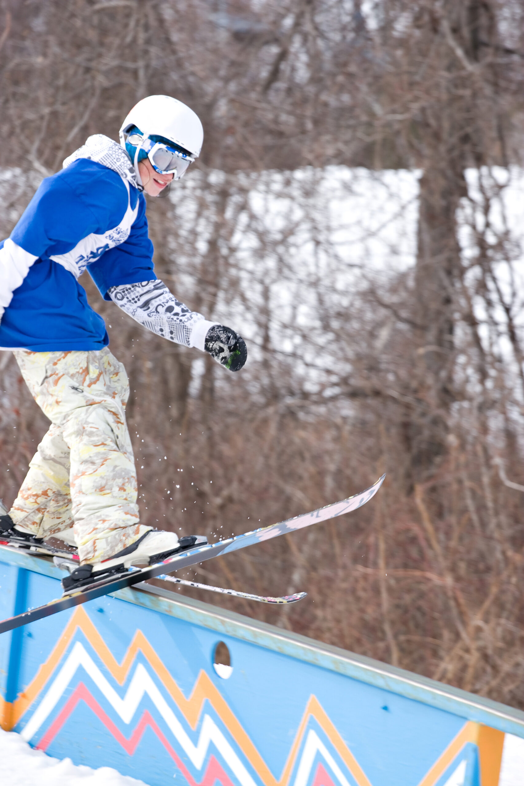 a young man performs a rail slide on skis BFBeGwwRSs scaled