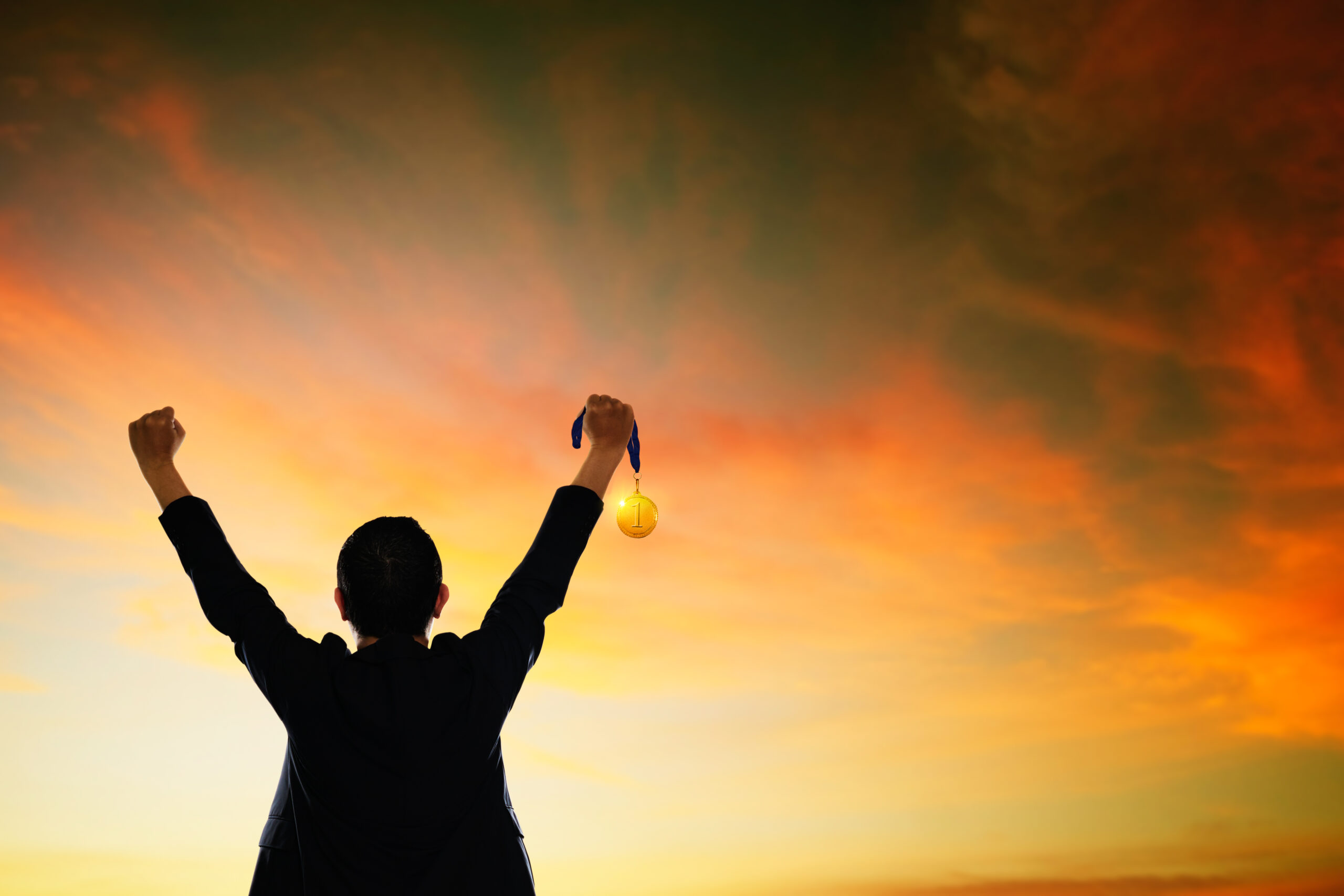 The Art of Self-Reliance: How to Trust Yourself and Thrive 3 graphicstock win concept businessman holding gold medal HdXlL13vesx scaled
