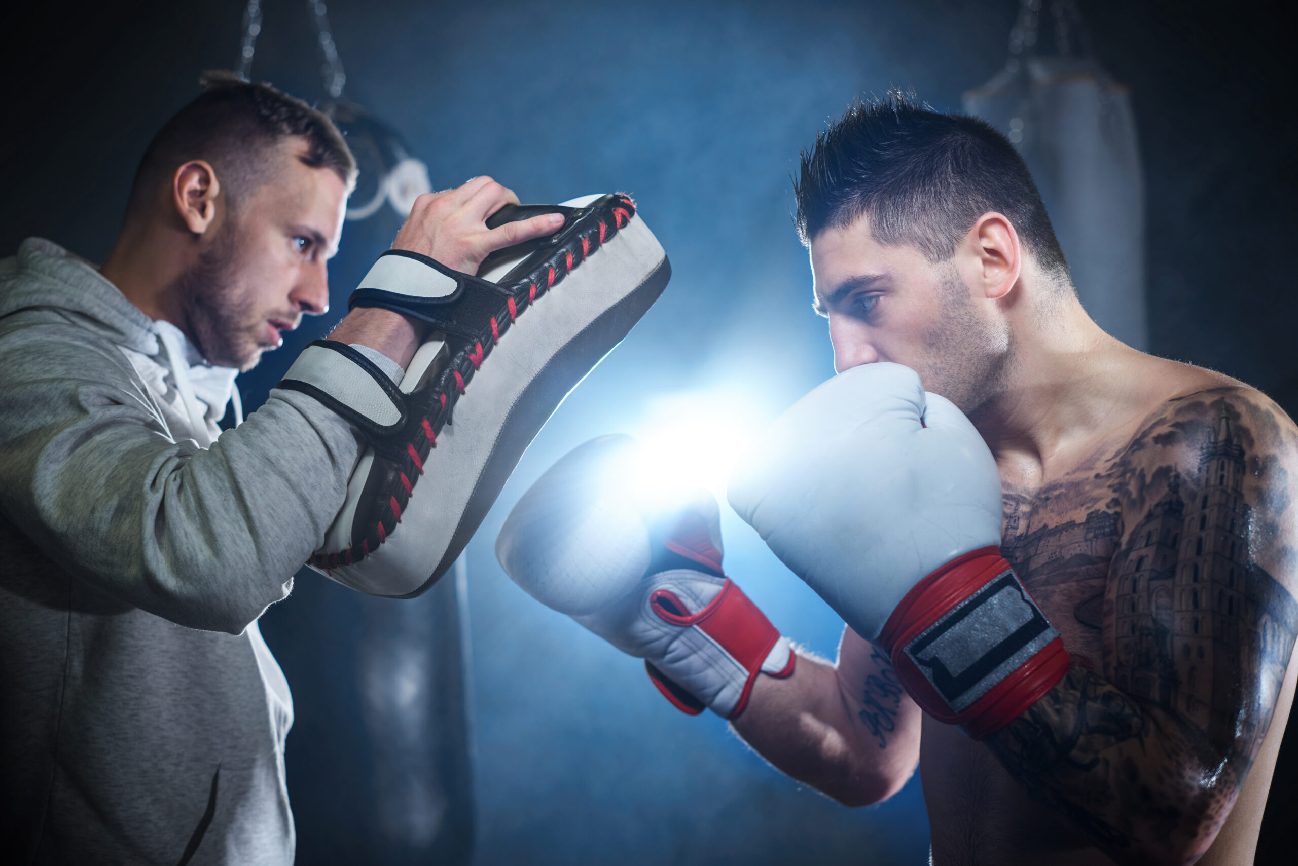 Stand Tall Alone: Mastering Independence in Everyday Life 3 storyblocks male boxer sparring with personal trainer rDUsi1FcM scaled